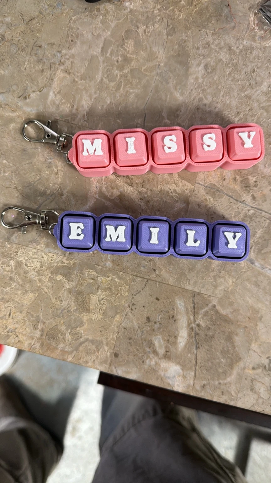 Pink and purple personalized name clickers